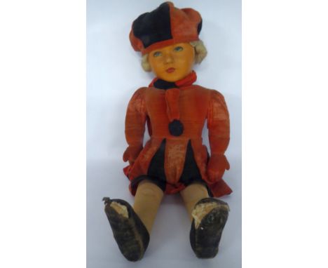 A CIRCA 1930'S DEAN'S RAG BOOK CO STUFFED FELT COVERED DOLL with moulded stiffened fabric face with painted details, wearing 