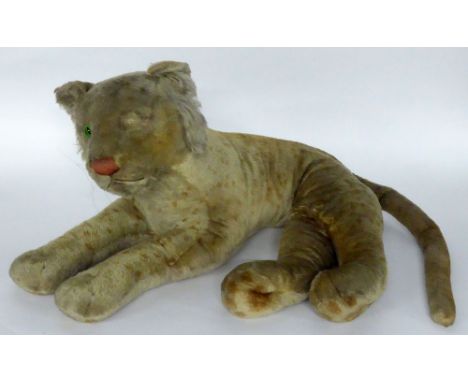 A 1950'S STEIFF LIGHT GOLDEN PLUSH 'JUNGLOWE' (LION CUB) in resting position with red stitched nose and bright green glass ey
