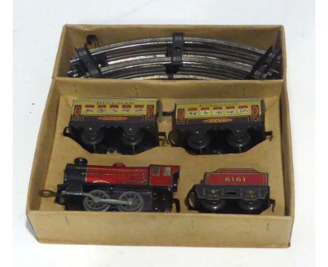 'HORNBY TRAIN' CIRCA 1930s '0' GAUGE LITHOGRAPH TIN PLATE CLOCKWORK M.O. PASSENGER SET containing 0-4-0 locomotive and tender