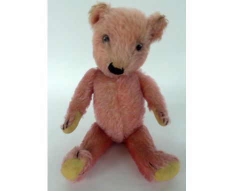 A RARE CIRCA 1930'S CHILTERN PINK PLUSH TEDDY BEAR, with cream felt pads and glass eyes 15" (38 cm) long