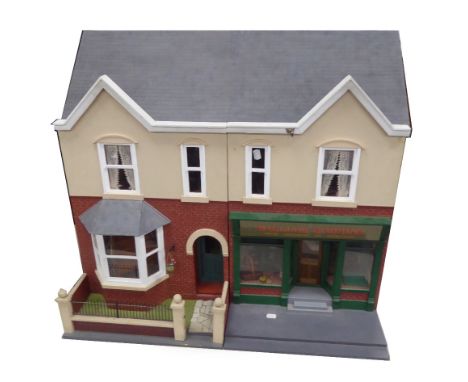 A POST WAR PAINTED WOOD DOLLS HOUSE,  in the form of an early Twentieth Century semi detached residence inter connecting with