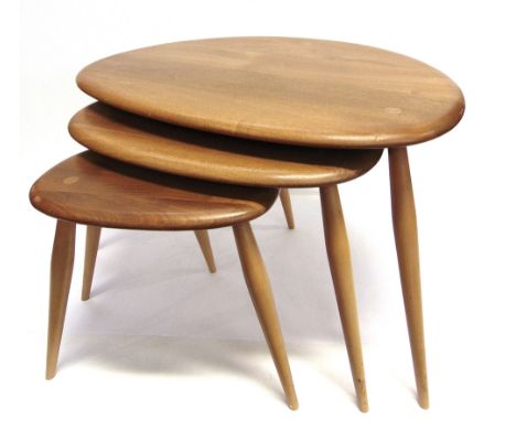 A NEST OF THREE ERCOL 'PEBBLE' OCCASIONAL TABLES  in light elm