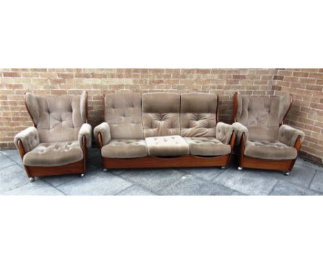 A 1960S G PLAN TEAK FRAMED 'SADDLEBACK' THREE PIECE SUITE  comprising three seater sofa and pair of armchairs