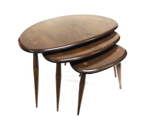 A NEST OF THREE ERCOL 'PEBBLE' OCCASIONAL TABLES  the largest 66cm wide 44cm deep 40cm high