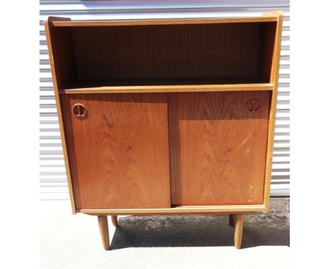 A DANISH TEAK BOOKCASE WITH OPEN SHELF  above sliding doors, 89cm wide 26cm deep 108cm high