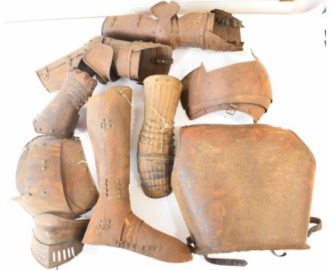 Nine pieces of Medieval style armour including breast plate, leg and foot vizor, arm, elbow and shoulder protection