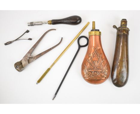 A collection of gun and shooting accessories including two copper and brass powder flasks, one G&amp;JW Hawksley, a pair of b