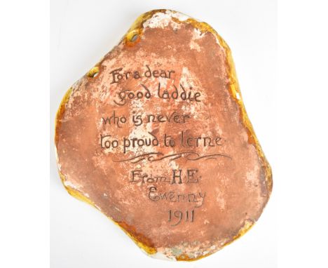 Horace Elliot for Ewenny Pottery Arts & Crafts crimped plaque inscribed with a verse from Chaucer surrounding a central armor