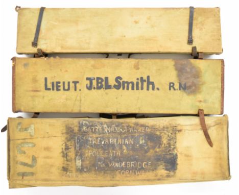 Three canvas and leather bound shotgun carry cases including one with lift out tray revealing ammunition compartment beneath,