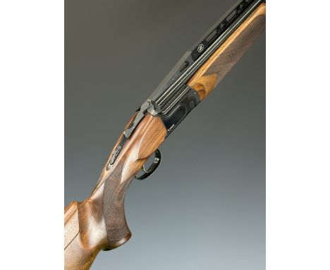 Antonio Zoli Kronos 12 bore over and under ejector shotgun with gold named locks and underside, chequered semi-pistol grip an