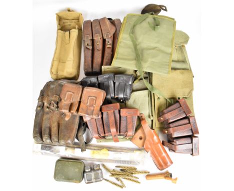 Collection of leather and canvas ammunition pouches including German WW1 style, S.M.G style cleaning kits for 12 gauge and ri