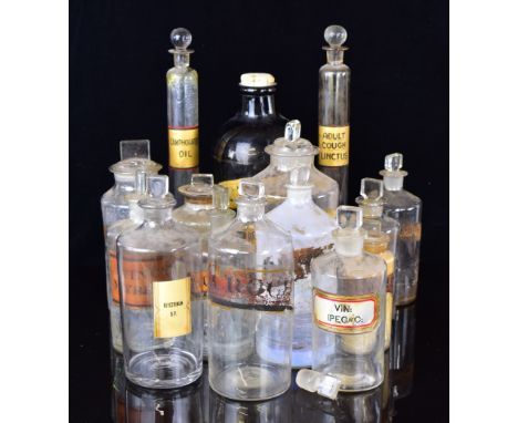 Fifteen vintage apothecary / medicine / chemist jars with stoppers, most with Latin script, tallest 30cm