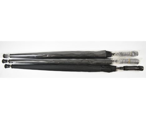 Three shooting stick umbrellas with LED torch to the handle, all unused in original packaging.