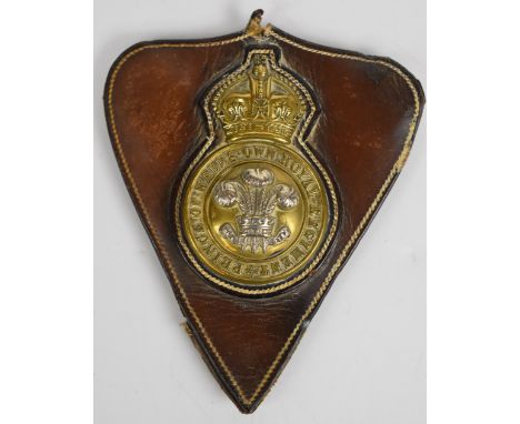 British Army brass martingale for the Prince of Wales Own Royal Regiment, on leather mount, 13 x 11cm