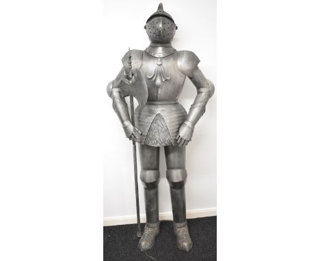 Replica suit of armour holding a battleaxe, H201cm.&nbsp;PLEASE NOTE: WE ARE NOT ABLE TO OFFER OUR USUAL POSTAGE SERVICE FOR 