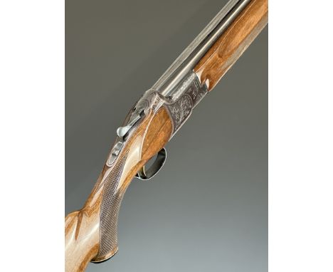 Miroku 12 bore over and under ejector shotgun&nbsp;with engraved locks, underside, trigger guard and thumb lever, chequered s