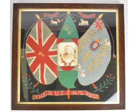 British Army The Queen's Regiment wool work with soldier's portrait photograph to centre flanked by regimental colours, one w