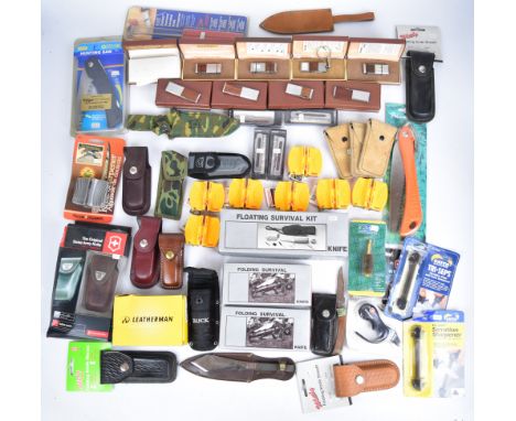 A collection of knives and knife related items including Leatherman, Victorinox and Kershaw, sharpeners, sheaths, Folding Sur