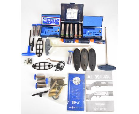 A collection of Beretta shotgun chokes and spare parts including 11 12 and 20 bore chokes, butt plates, triggers, patch etc.&