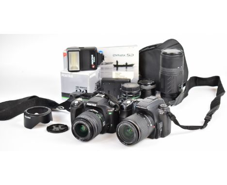 Two digital SLR cameras comprising Konica Minolta Dynax 5D with AF DT zoom 18-70mm 1:3.5-5.6D lens and charger and Pentax *is