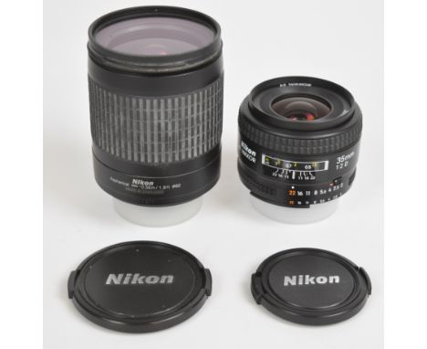 Two Nikon SLR camera lenses comprising AF Nikkor 35mm 1:2 D and AF Nikkor 28-100mm 1:3.5-5.6 G, both with Nikon lens caps