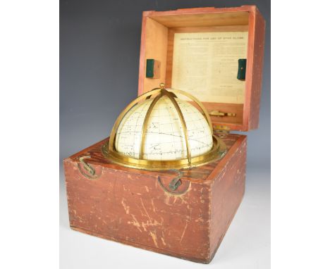 Husun star globe by H Hughes &amp; Son Ltd and dated 1920, with brass framework, in original fitted carry case, diameter of g