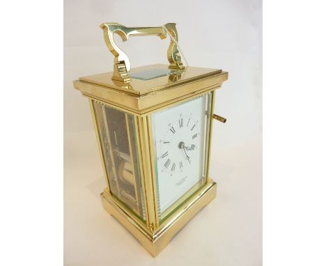 A large brass-cased striking carriage clock