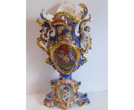 A large late 19th century Continental porcelain vase of elaborate rococo form; the central vignette depicting one of Henry VI