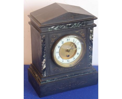A late 19th century black-marble eight-day mantel clock, the cream chapter ring with Arabic numerals and the individually num