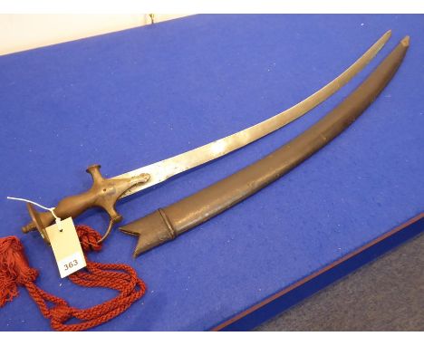 An Indian Talwar, typical shaped hilt attaching to a sabre blade and within wooden and black-leather covered scabbard (total 