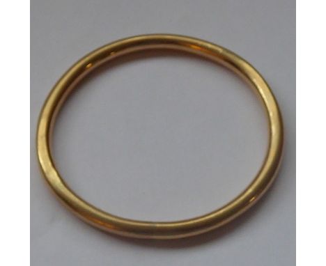 A yellow-metal bangle engraved Gwynneth, 7cm diameter&nbsp;