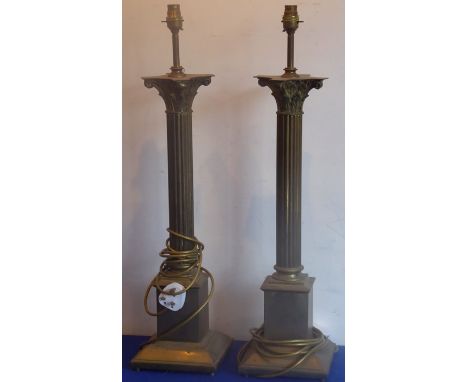 Two large brass lamps modelled as Corinthian columns, 73cm (full height including light fittings) In our opinion the brass la