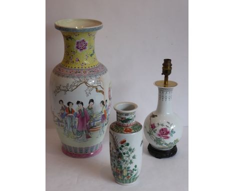 Three Chinese porcelain vases, 20th century, one of rouleau form painted in a famille-verte palette in Kangxi style with phea