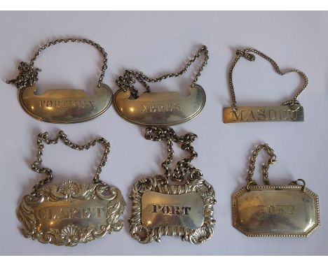 An assortment of 19th century silver/silver-plated wine/spirit tickets comprising a pair of crescent moon-shaped tickets 'Por