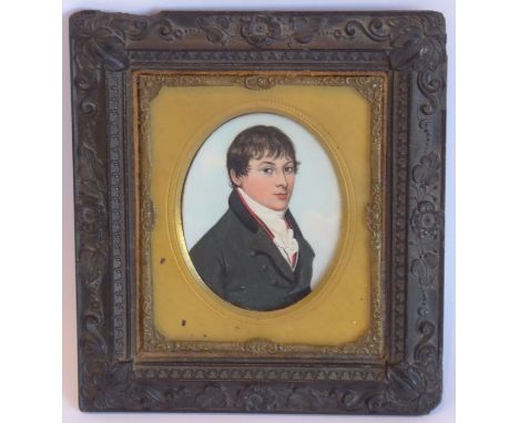 An early 19th century oval portrait miniature of a young gentleman with white cravat and black jacket (later frame height 12c