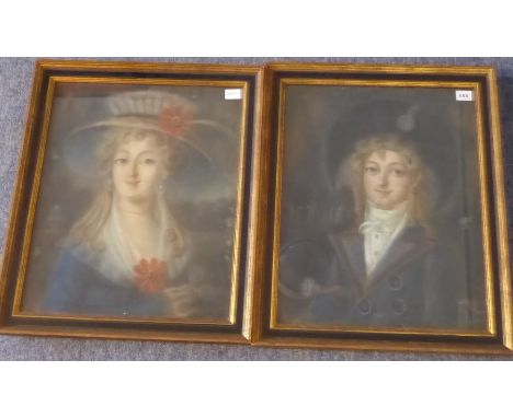 A pair of framed and glazed early 19th century pastel shoulder-length portrait studies of a similar male and female subject, 