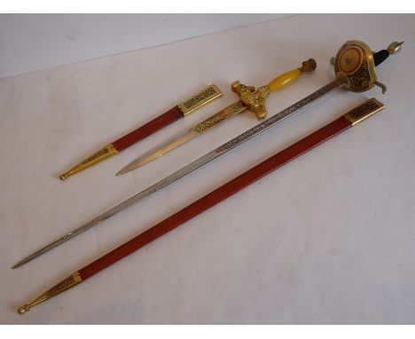 A Spanish Toledo rapier having gilt-metal hilt and within tan-leather scabbard, together with one other similar smaller dagge