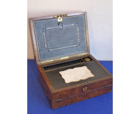 A good 19th century dome-topped walnut lap desk, hinged lid opening to reveal fitted interior with cartouche-shaped white-mar