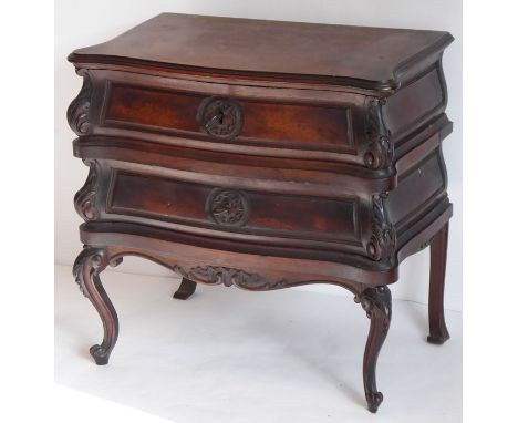 A 19th century walnut two-drawer jewellery box in the form of an 18th century European commode, serpentine fronted, the two d