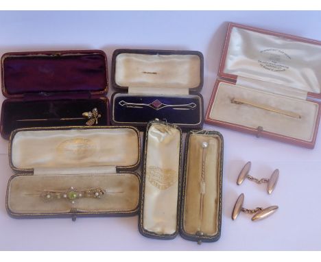 A selection of gold stick pins etc., (one 18-carat without mount) to include mounted with various stones and boxed, together 