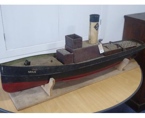 A custom-built model of a steam boat 'Sirius', the decking lifting to reveal original boiler, funnel and mechanical parts etc