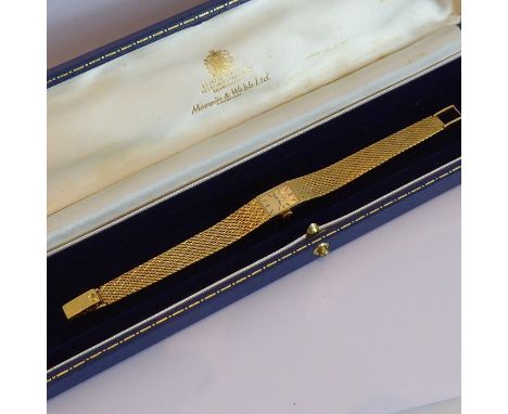 A ladies boxed 18-carat yellow-gold (marked 18) dress wristwatch having integral textured bracelet, the rectangular dial with