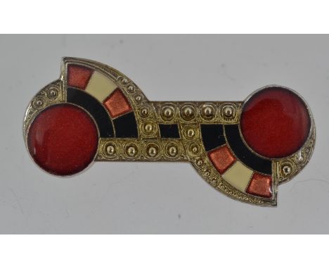 A vintage Art Deco white metal brooch with geometric enamel decoration with roller clasp. Measures 5cms.