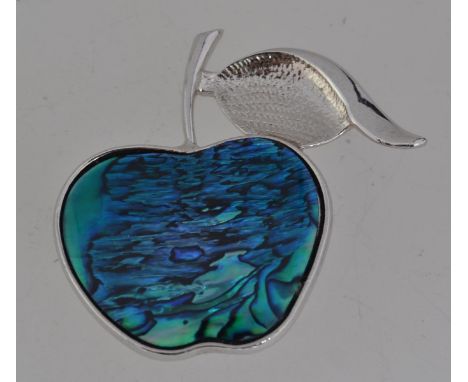 A vintage white metal figural brooch in the form of an apple with abalone decoration with roller clasp. Measures 4cms.