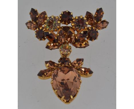 A vintage signed yellow metal Austrian crystal drop brooch with roller clasp. Marked for Schoffel  & Co with the crown and Au
