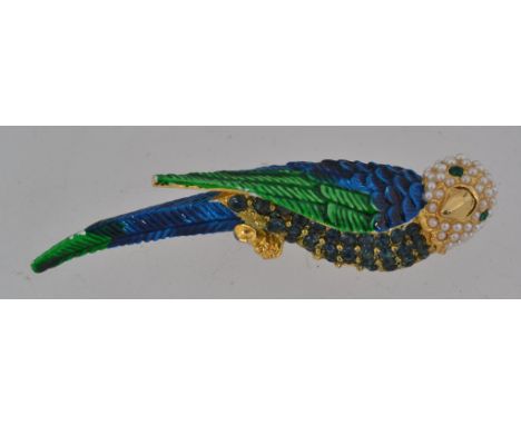 A vintage yellow metal figural brooch in the form of a budgerigar parrot with pave set rhinestones chest and with seed pearl 
