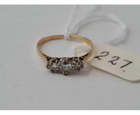 A three stone diamond ring 18ct gold size M    