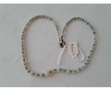 A FINE OPAL BEAD NECKLACE WITH CRYSTAL SPACERS