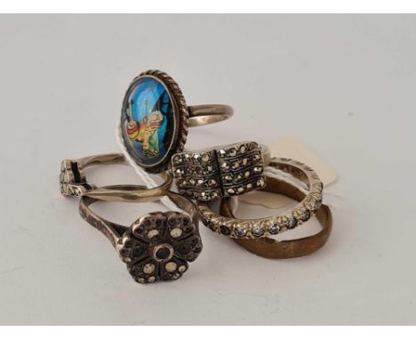 Six silver and other rings including butterfly ring example