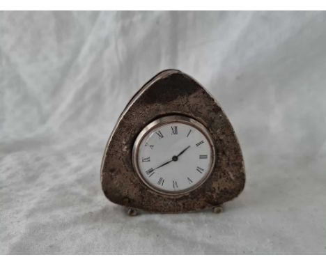 A silver cased mantle clock with enamel dial, 2.5" high